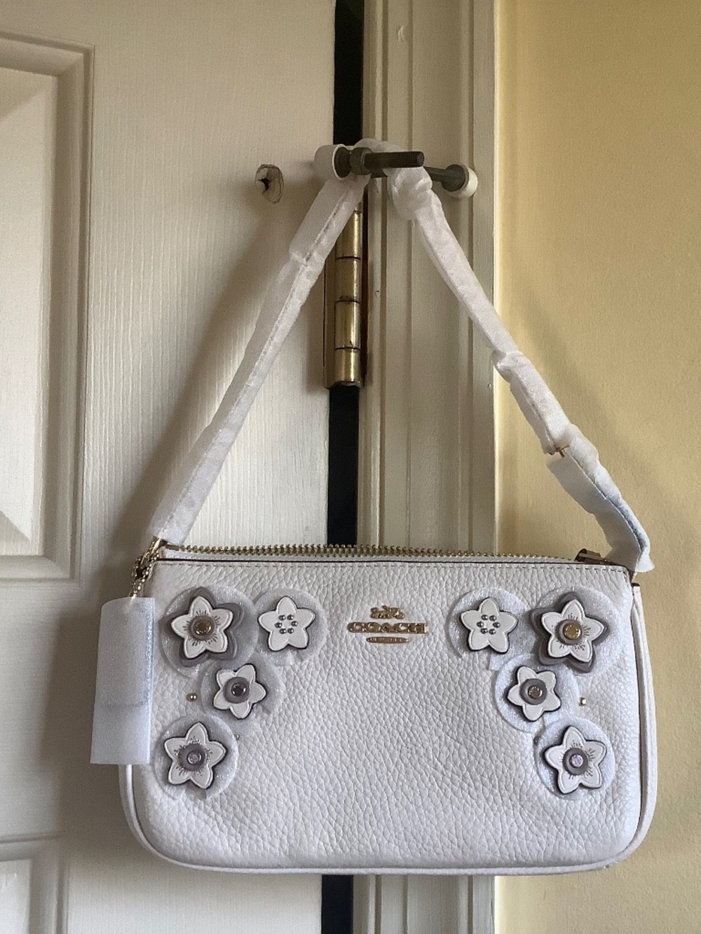 Coach Pebbled Leather Floral Appliqué Large Wristlet With Gold Chain Chalk